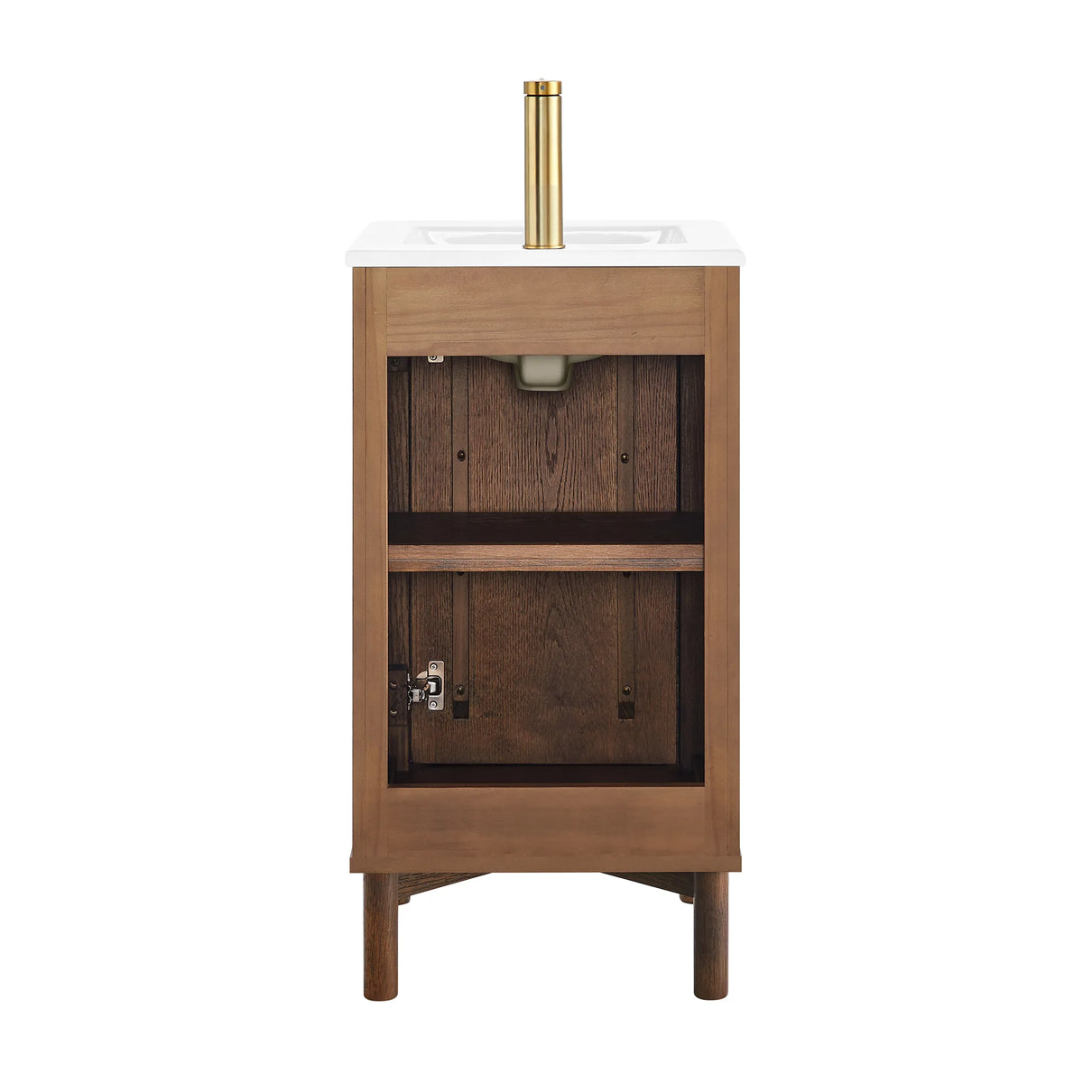 The 18-inch vanity in the studio, door off-frame, with an empty shelf and back panel; the faucet pictured is not included