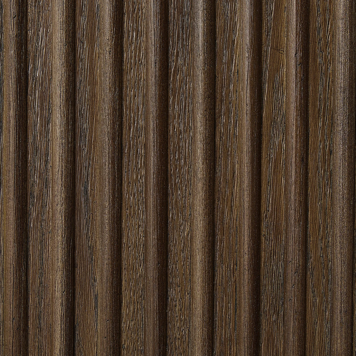 Full-frame texture of ribbed dark wood, each flute catching light along its ridge