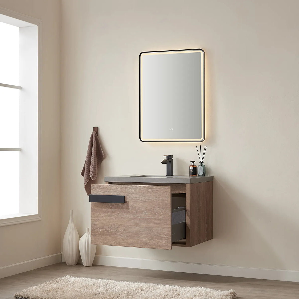 Lit mirror above the vanity while the drawer stands open