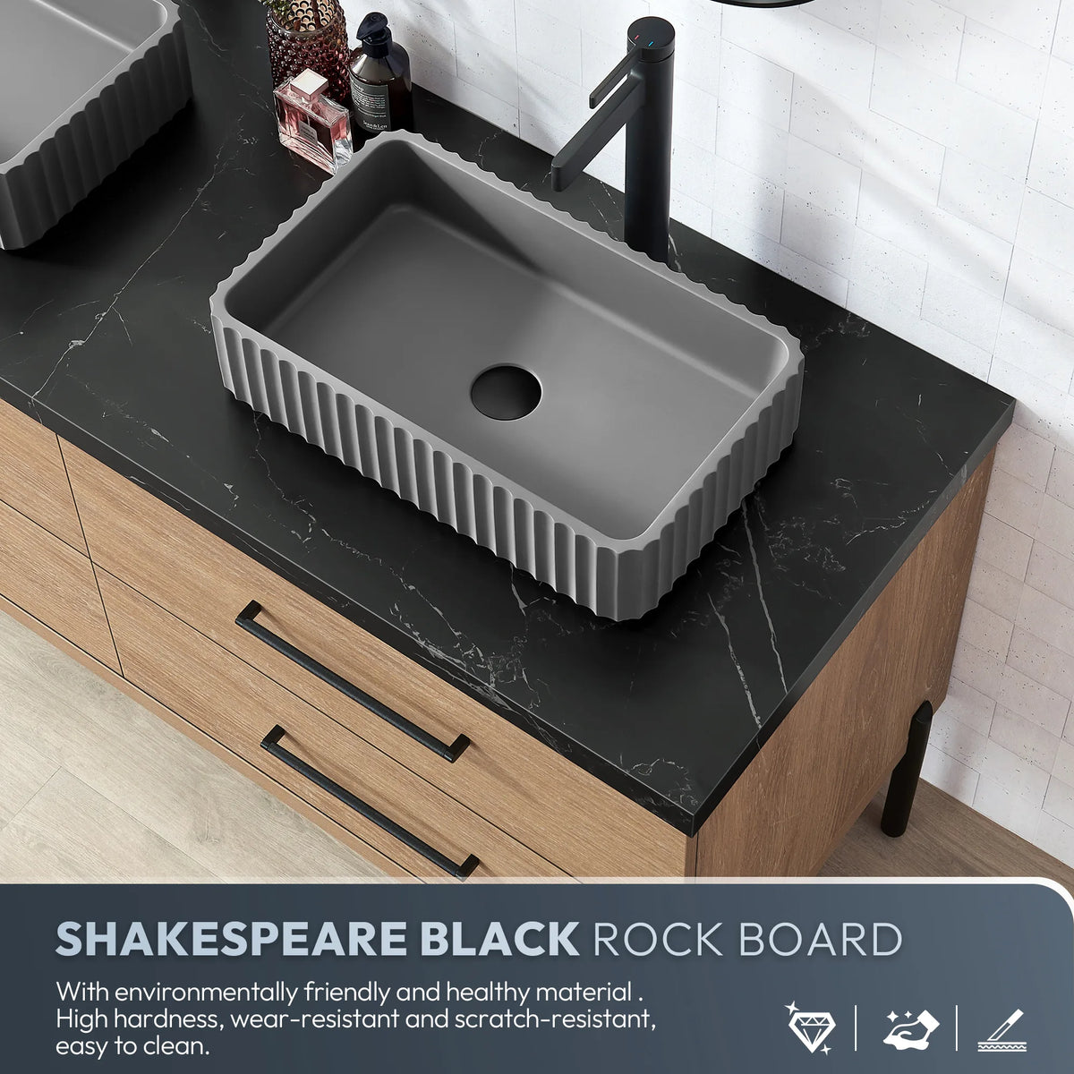 Stone feature panel pairing the black top with the rectangular ribbed concrete vessel