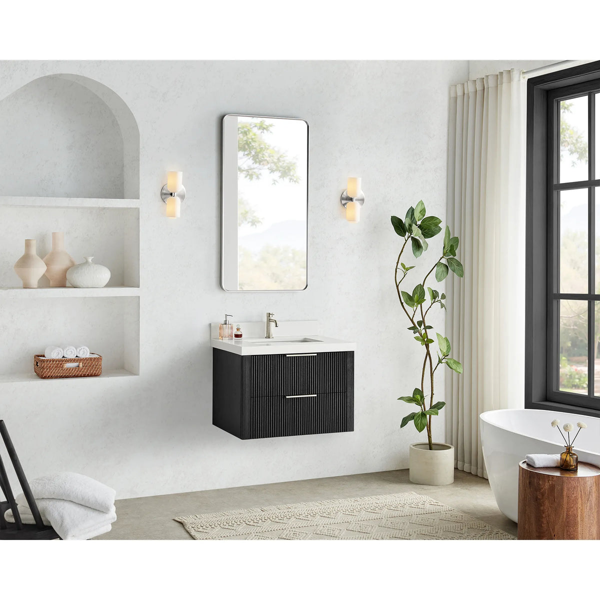 30 inch floating vanity in Oak Weathered Black, hung in a bright bathroom with a window, arched niche and soaking tub