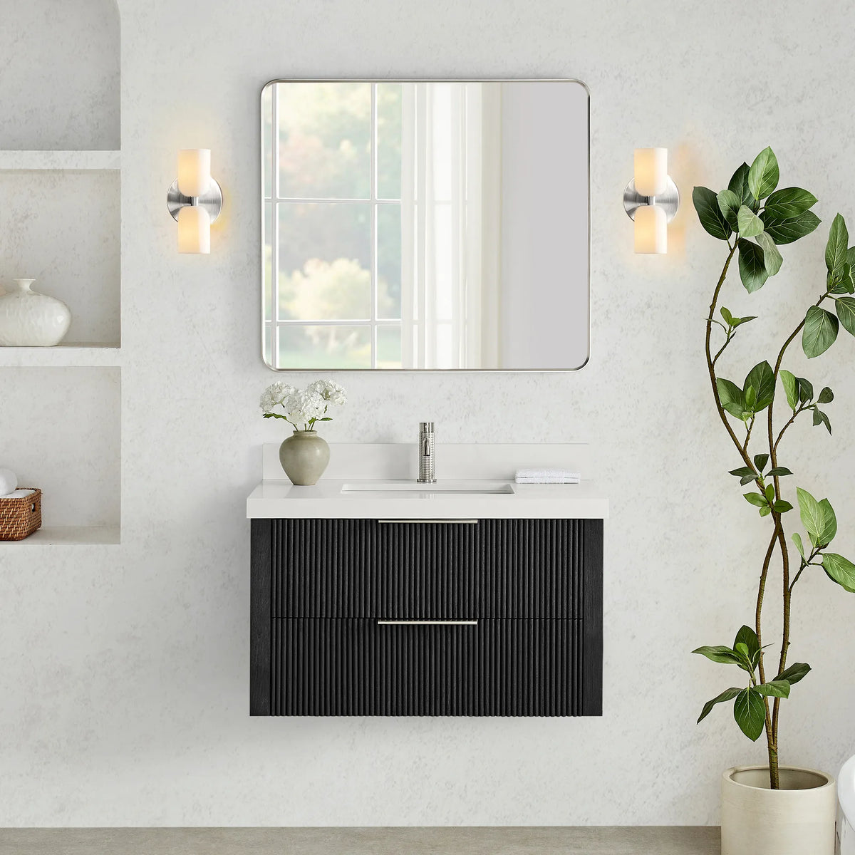 Wall-hung vanity in Oak Weathered Black with a rounded-rectangle mirror set between two wall sconces on a textured wall