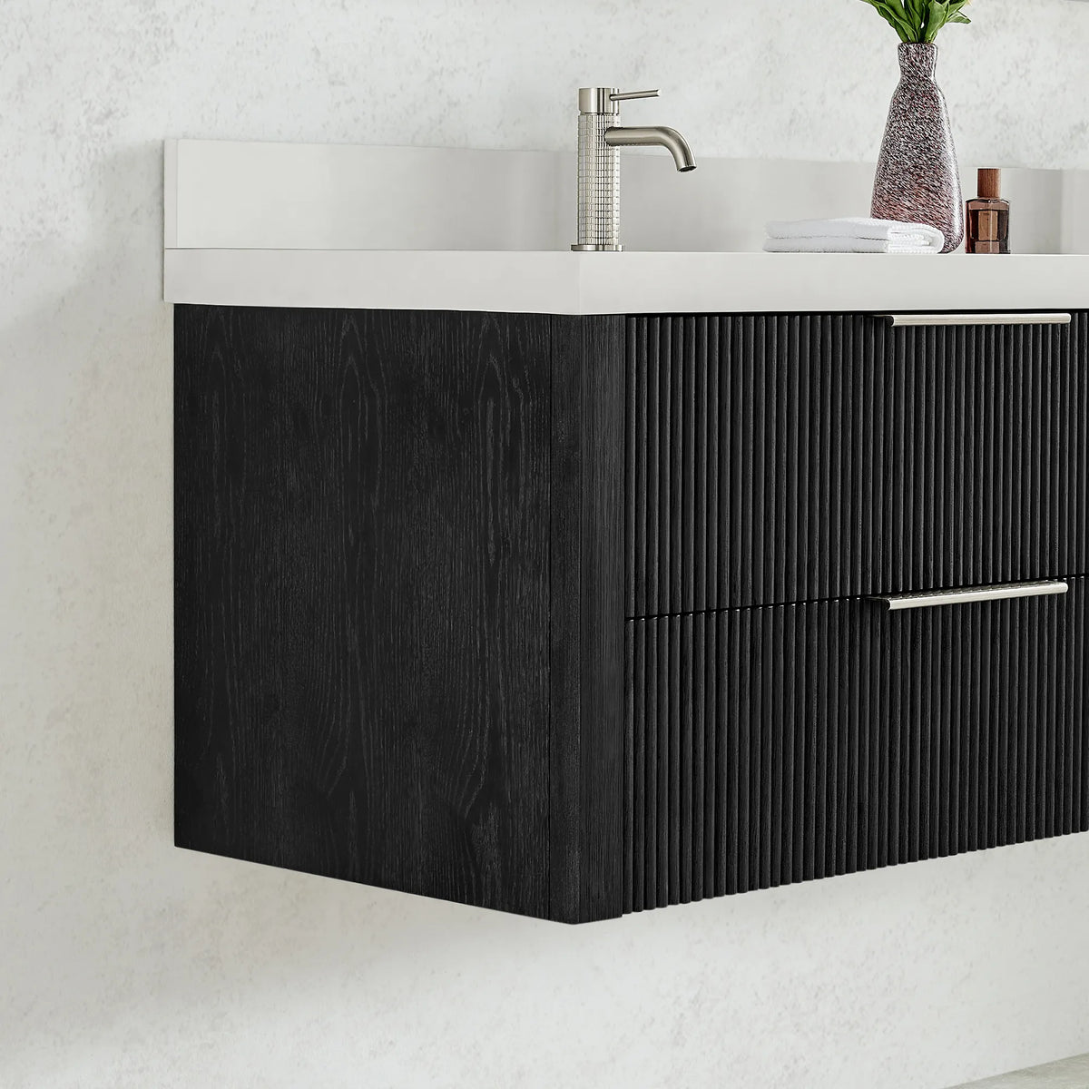 Cabinet side and corner of the floating 48 inch vanity with a faucet pictured, fluted drawer fronts in Oak Weathered Black