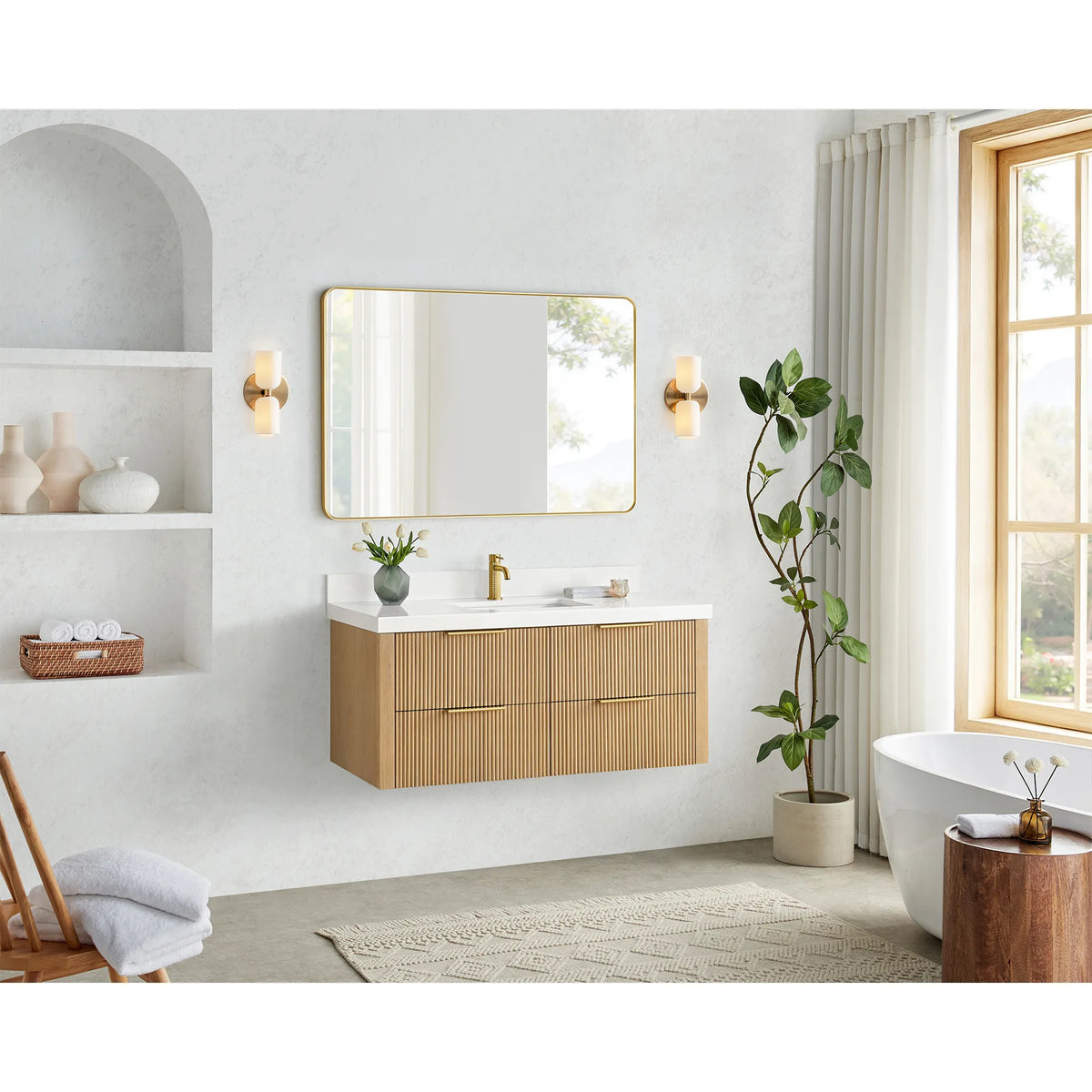 48 inch floating vanity in Washed Ash Grey, hung in a bright bathroom with a window, arched niche and soaking tub