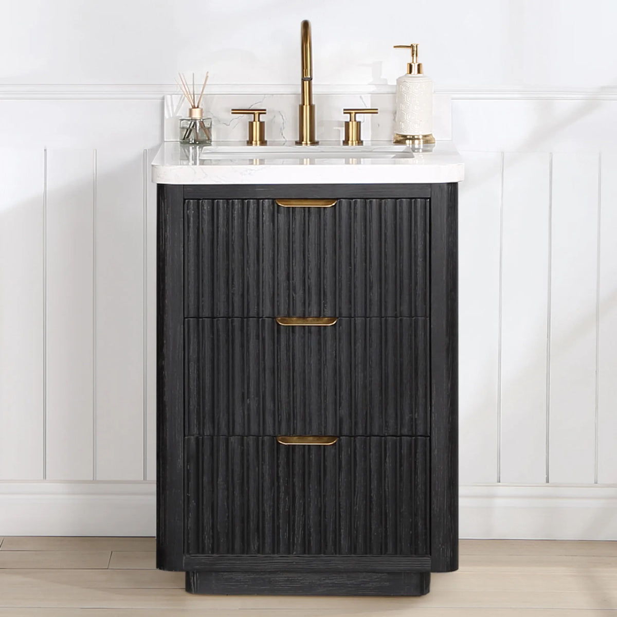 Freestanding 24 inch vanity in a bright bathroom with wainscot walls, a displayed faucet and soap dispenser