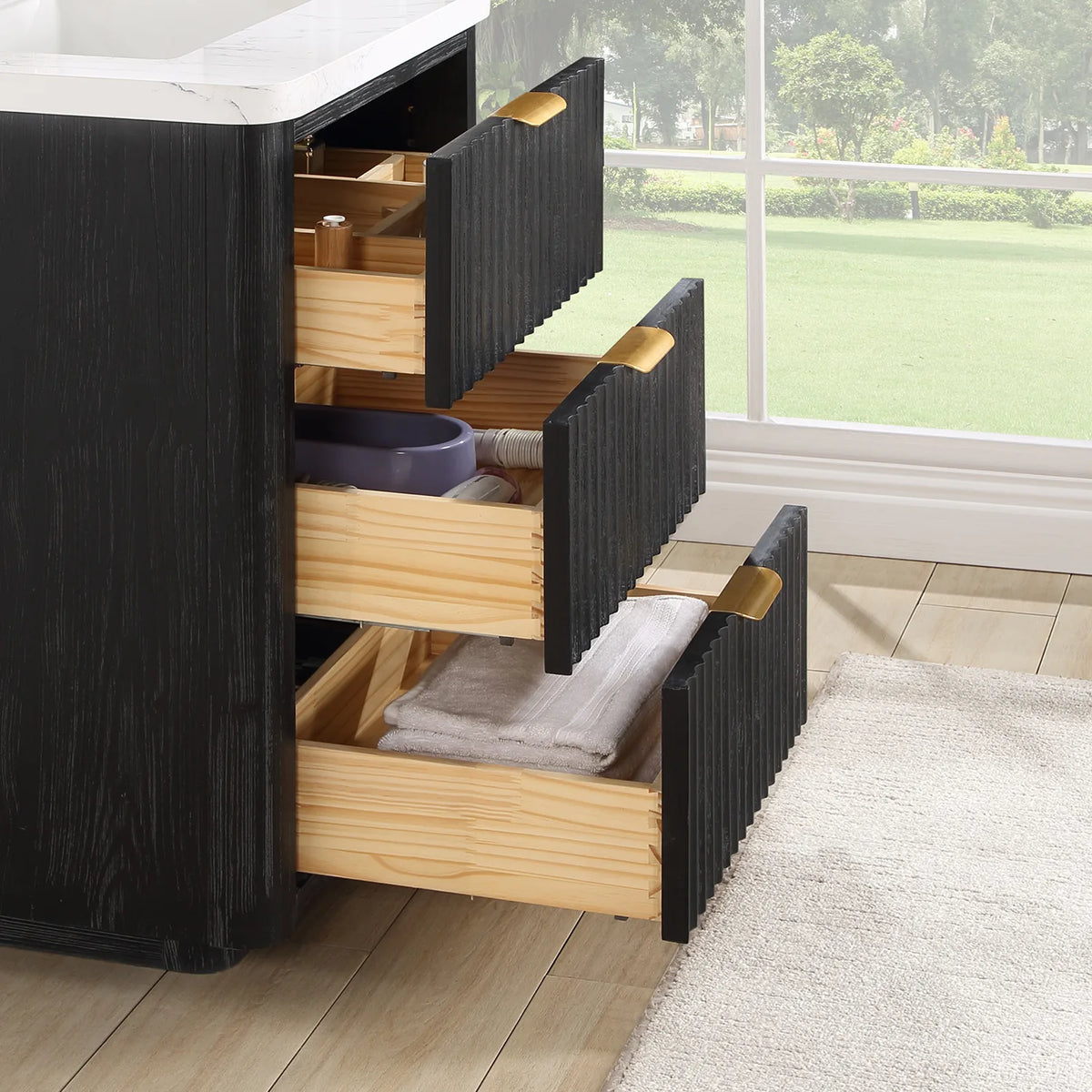 Side view of the open drawers on the 24 inch Fir Wood Black vanity, with inserts and stored items inside