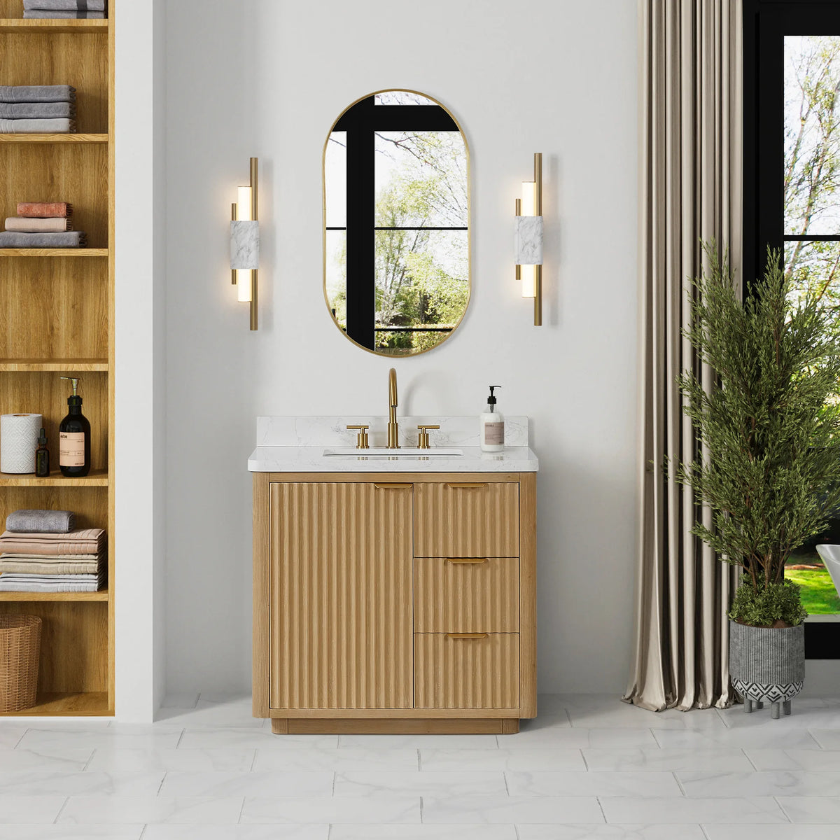 36 inch wood vanity in a bright bathroom beside a tall shelf unit, with a floor plant and oval mirror