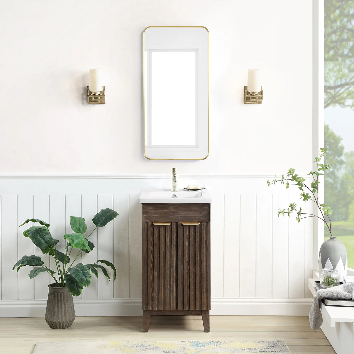 A bath with white paneled walls: 18-inch single vanity in Spruce Aged Brown under a rectangular wall mirror