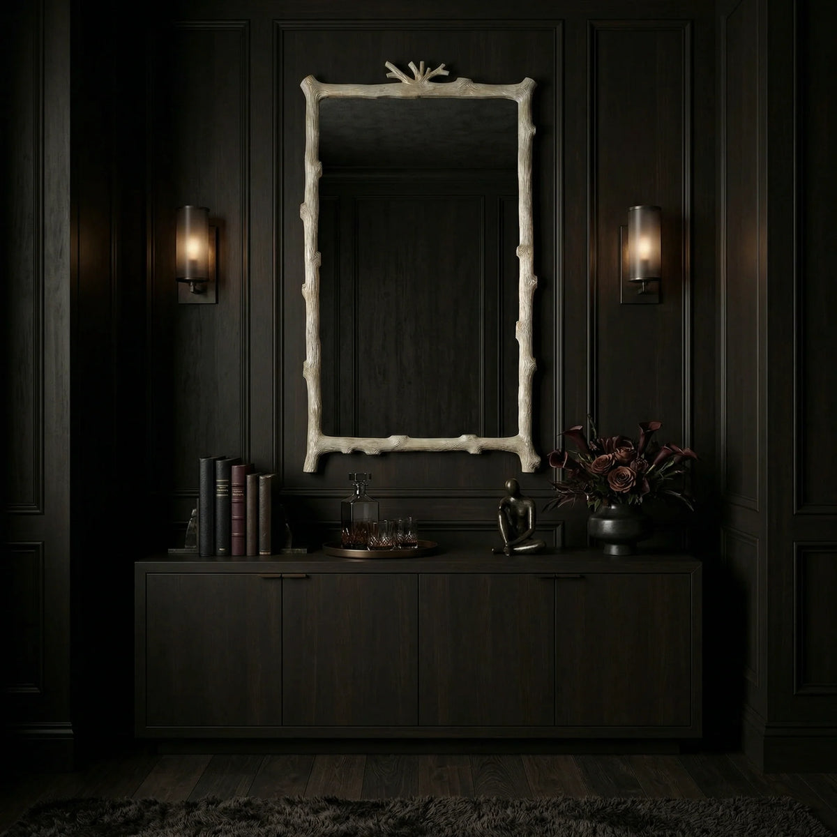 30 inch Twig Mirror by Ambella Home with soft gold leaf branch-inspired frame, styled above a dark credenza in a moody hallway interior