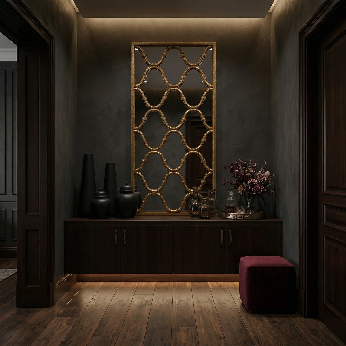 Ambella Home Fret Mirror in antique wire brush gold, 81.5W x 2D x 40H decorative fretwork wall mirror above a dark wood credenza in a luxury hallway entry