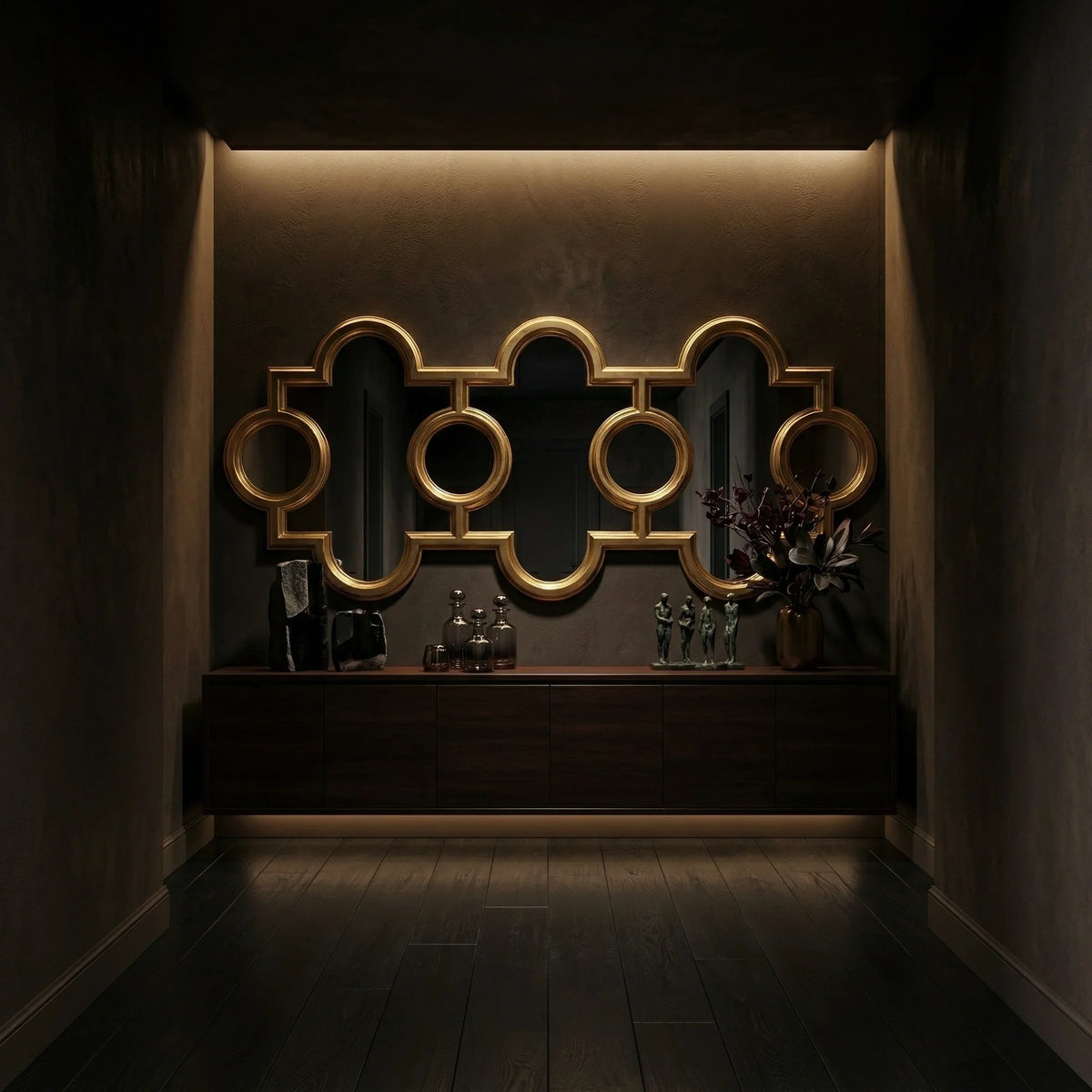 99 inch Voranado Mirror by Ambella Home with burnished gold leaf finish and linked round-and-arch design, styled above a long walnut console in a moody modern entryway