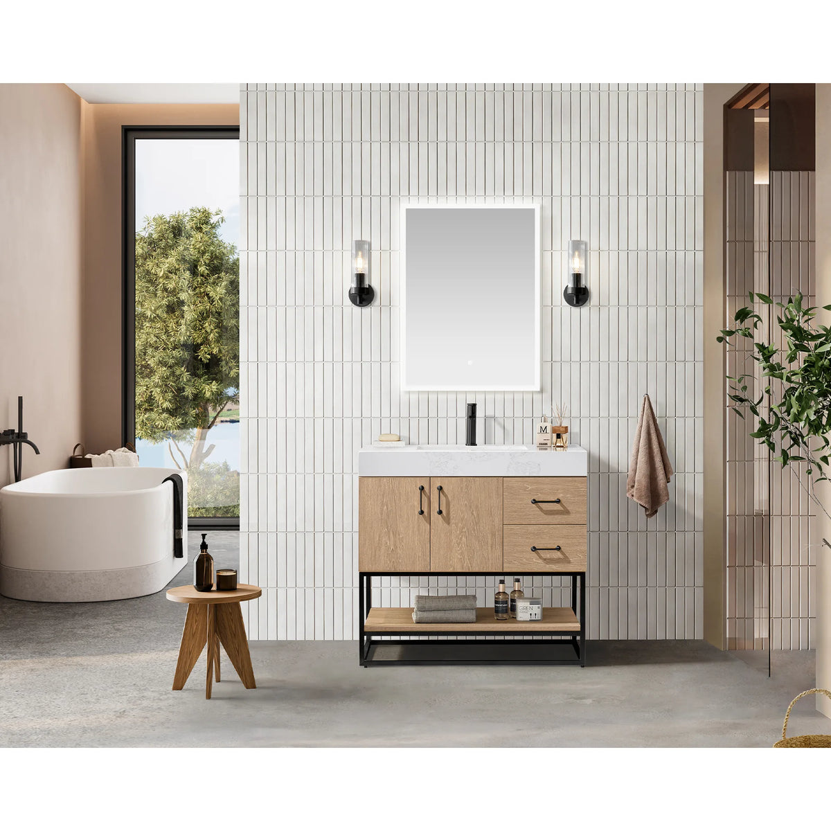 Lifestyle shot of the vanity in a tiled bathroom with a soaking tub, wall mirror and wooden stool