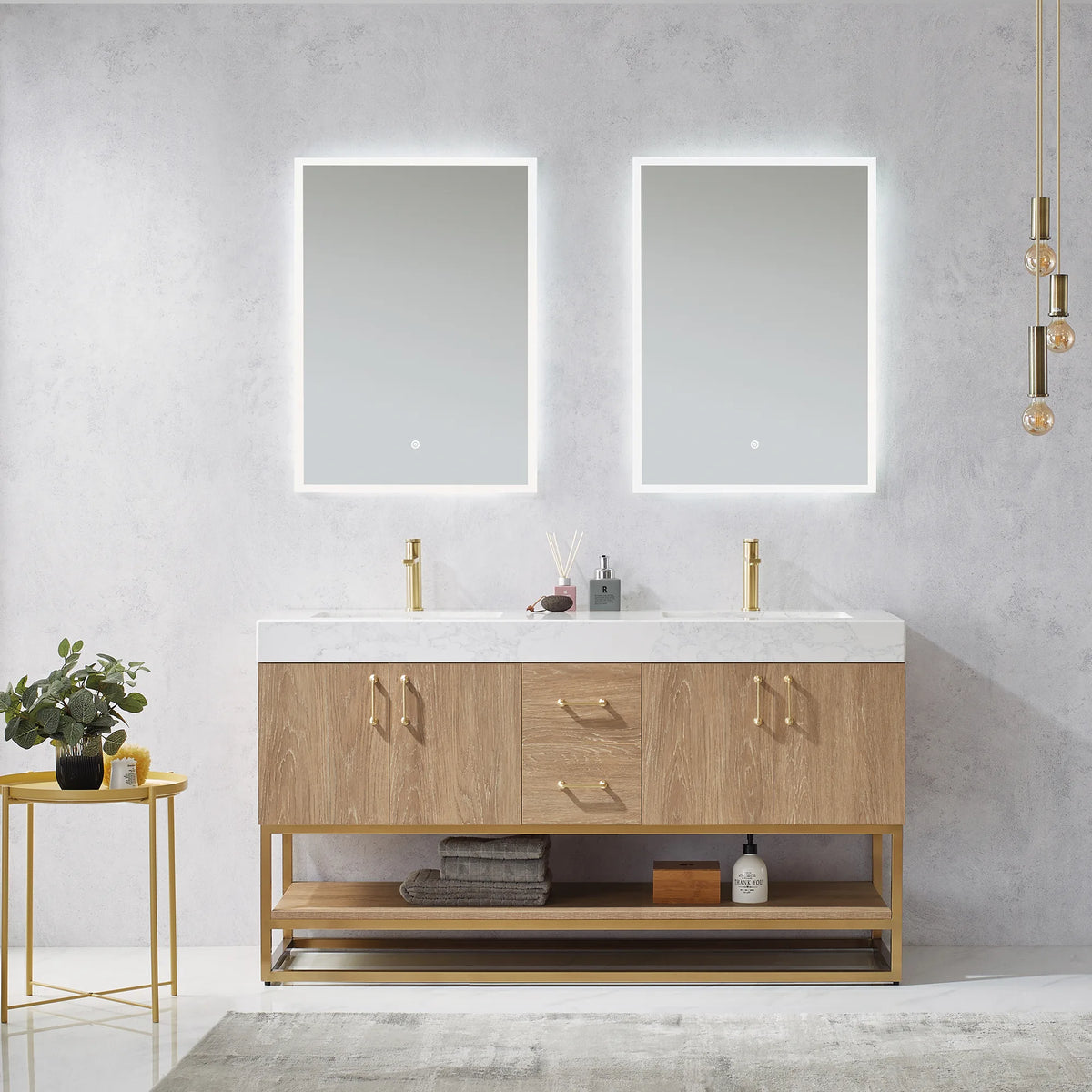Straight-on room view of the double vanity under two LED mirrors, with side table, plant and decor on the counter