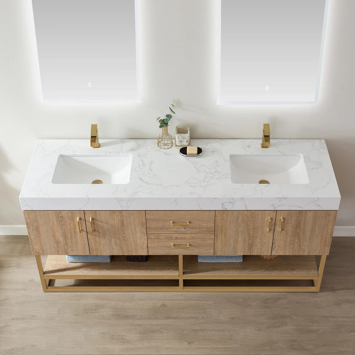 Overhead close-up of the white grain stone top and undermount ceramic sink area, with decor on the counter