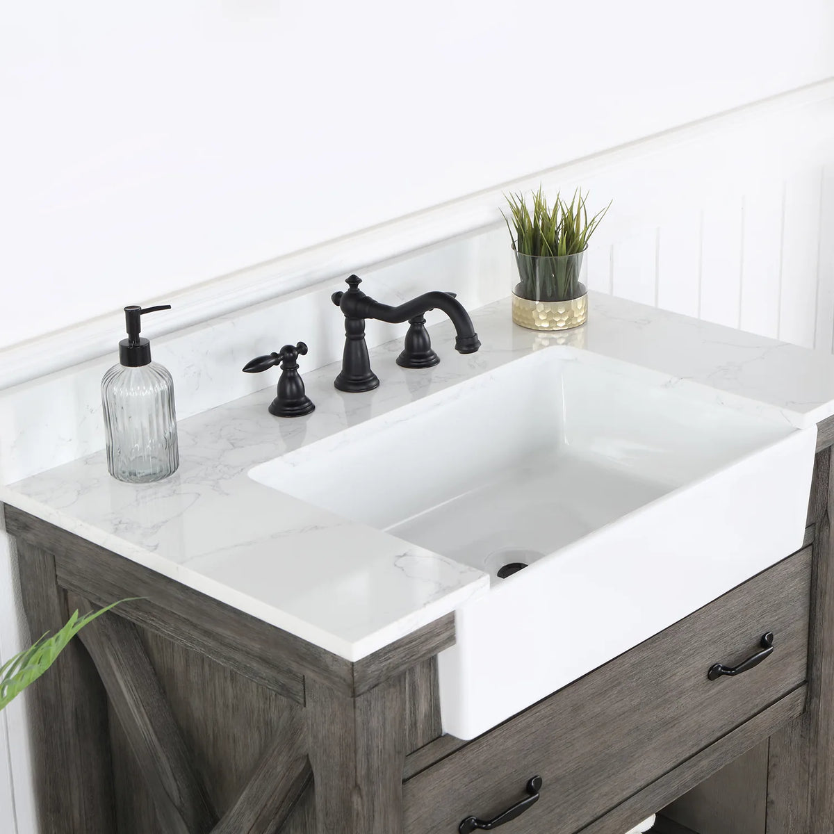 Angle across the white basin and backsplash with a black widespread faucet (sold separately)