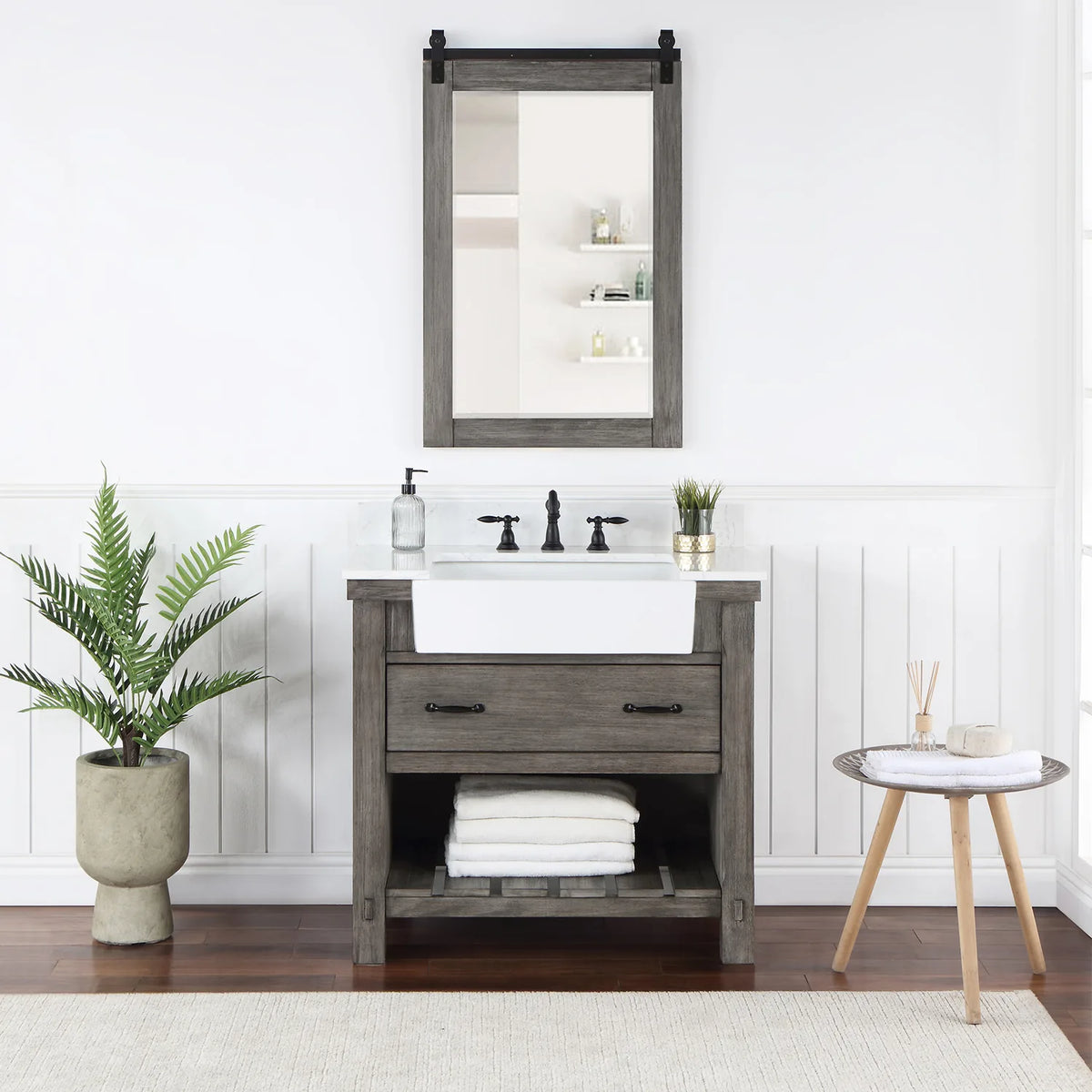Rectangular mirror with sliding-rail hardware hung over the vanity in a styled room