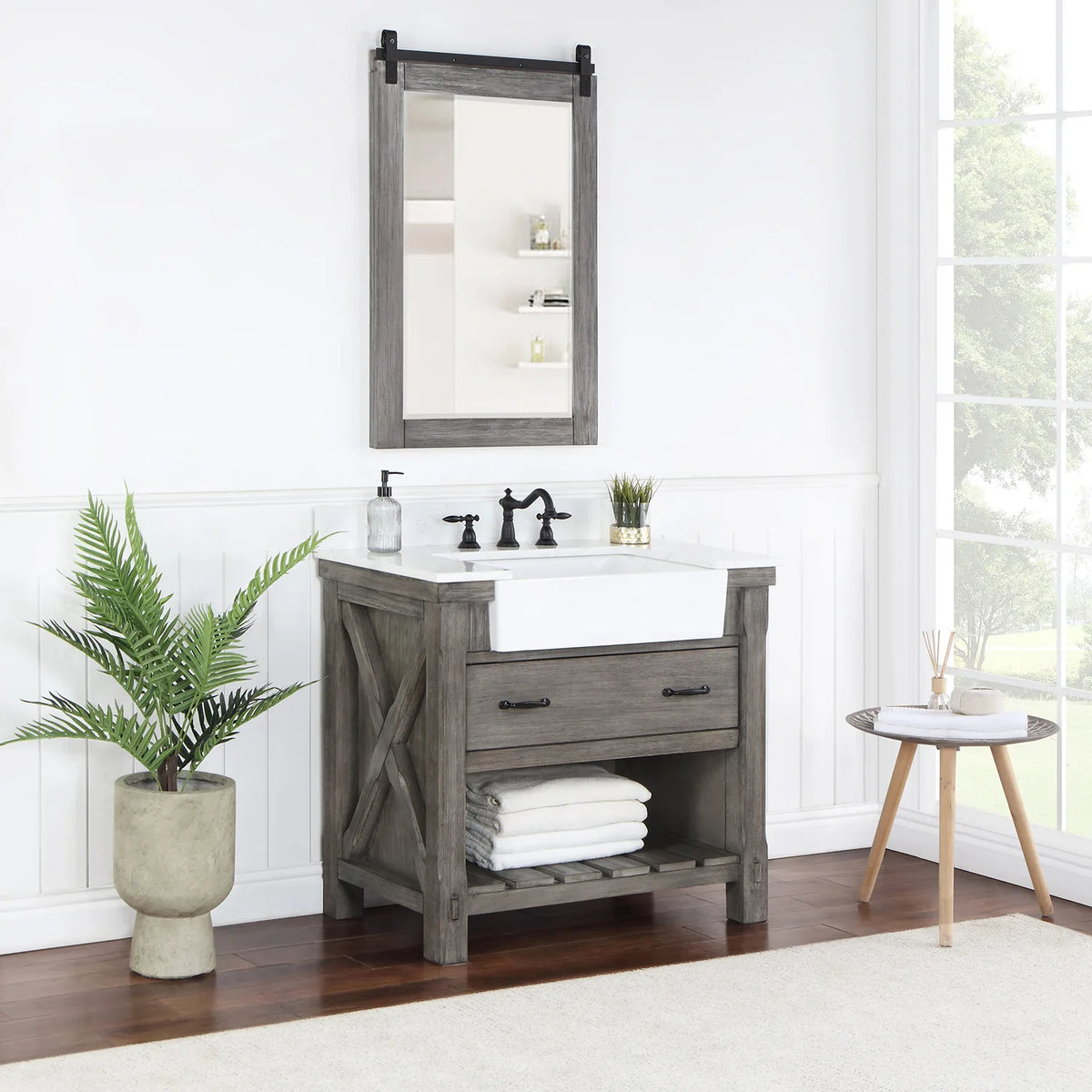 Styled bathroom with vanity, mirror, plant and towels on the slatted open shelving