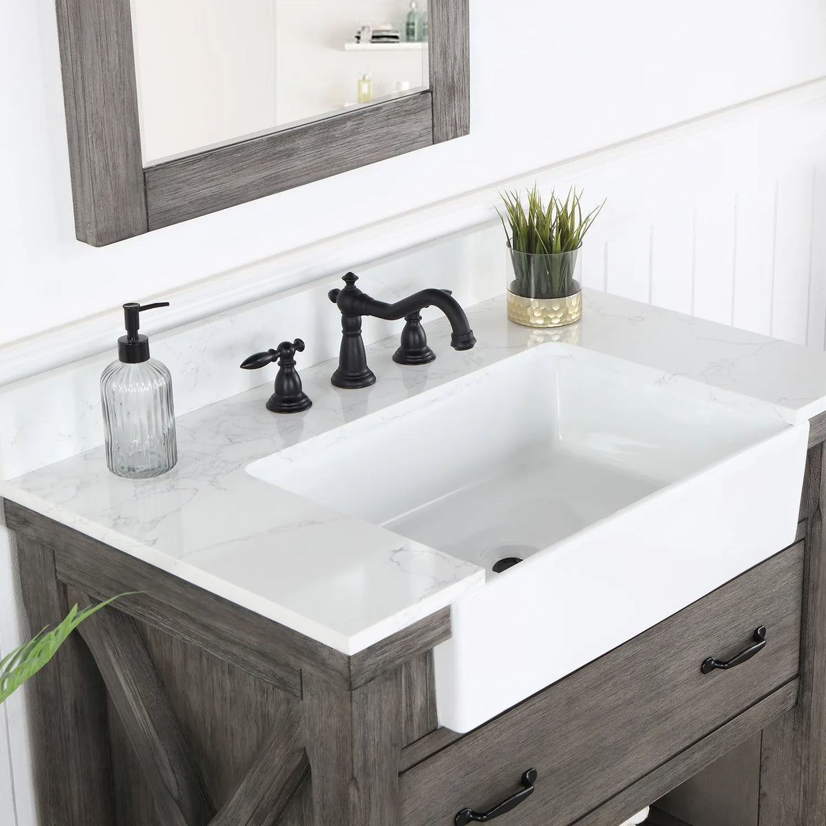 Deep white basin set into the stone top, seen from the side with the faucet