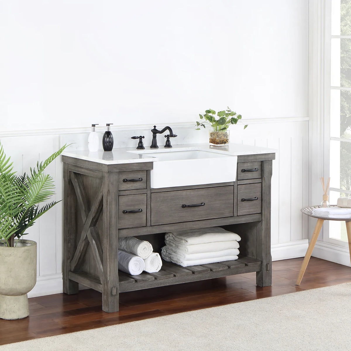 Side-angle shot of the crossed brace on the vanity side panel and the slatted open shelving