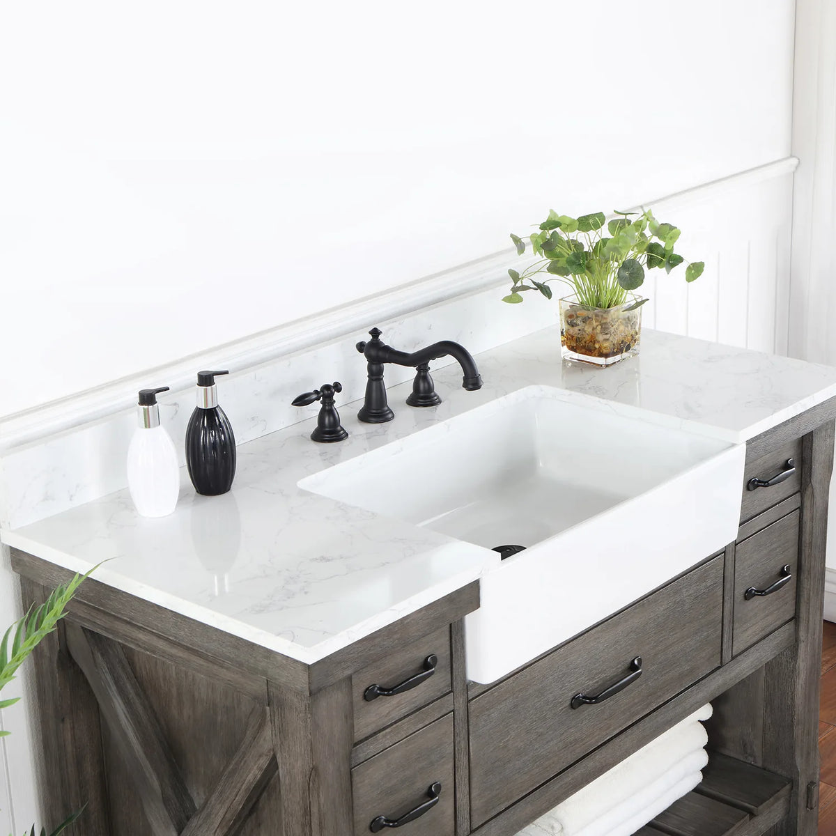 Angle across the white basin and backsplash with a black widespread faucet (sold separately)
