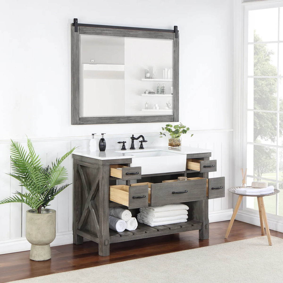 Mirror above the Classical Grey vanity while the center and side drawers stand open