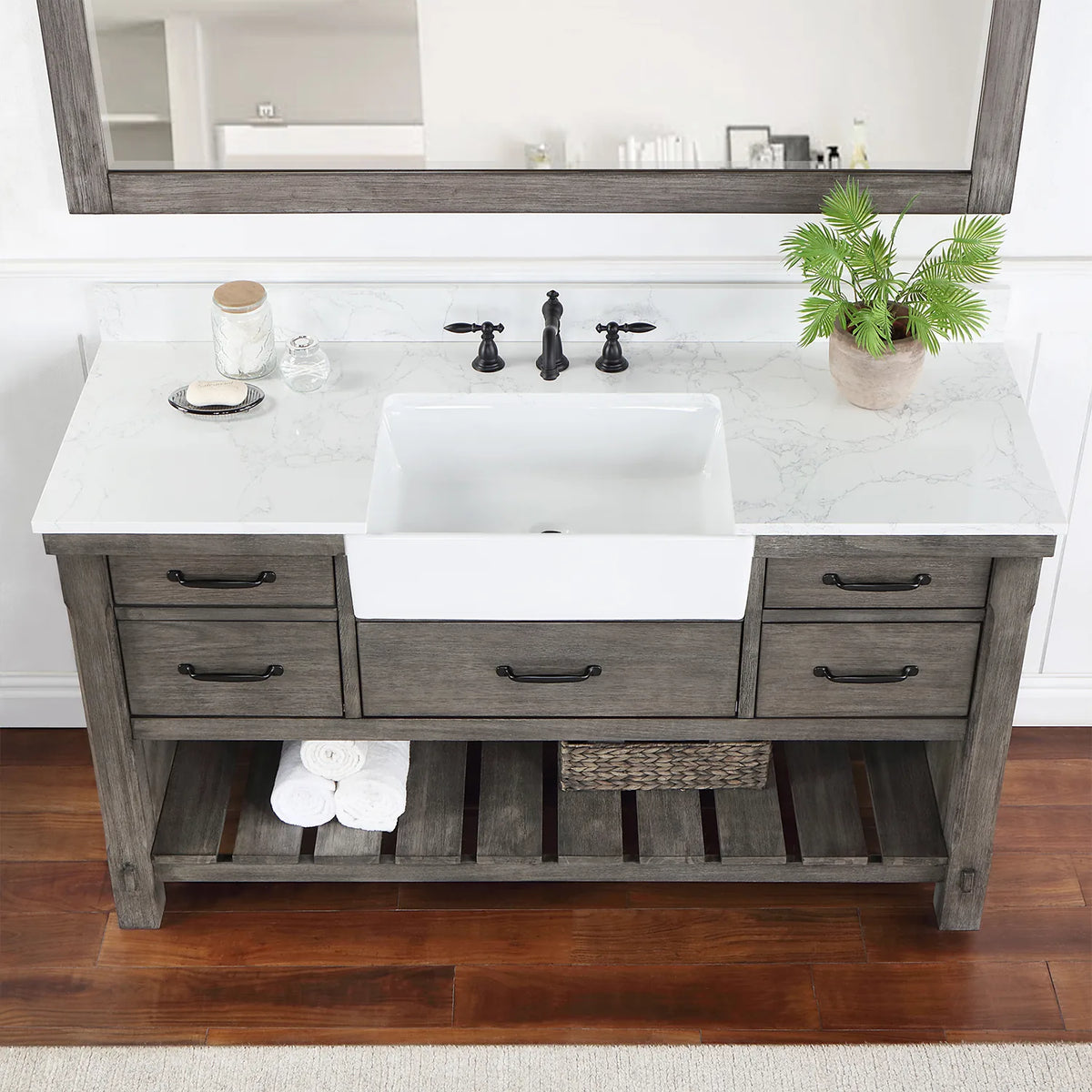 Stone top and white basin in a tighter crop, matte black pulls on the drawer fronts below