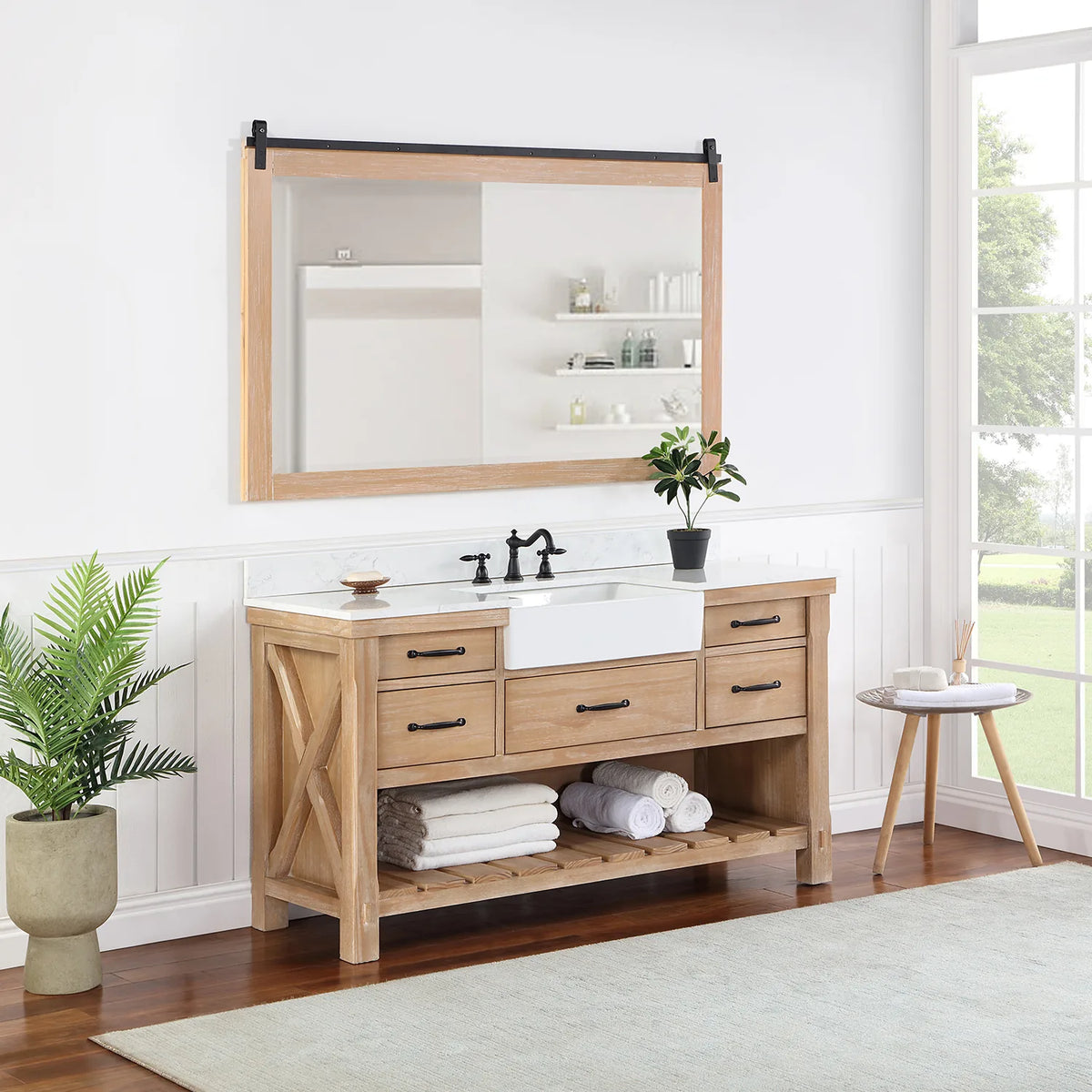Styled bathroom with vanity, mirror, plant and towels on the slatted open shelving