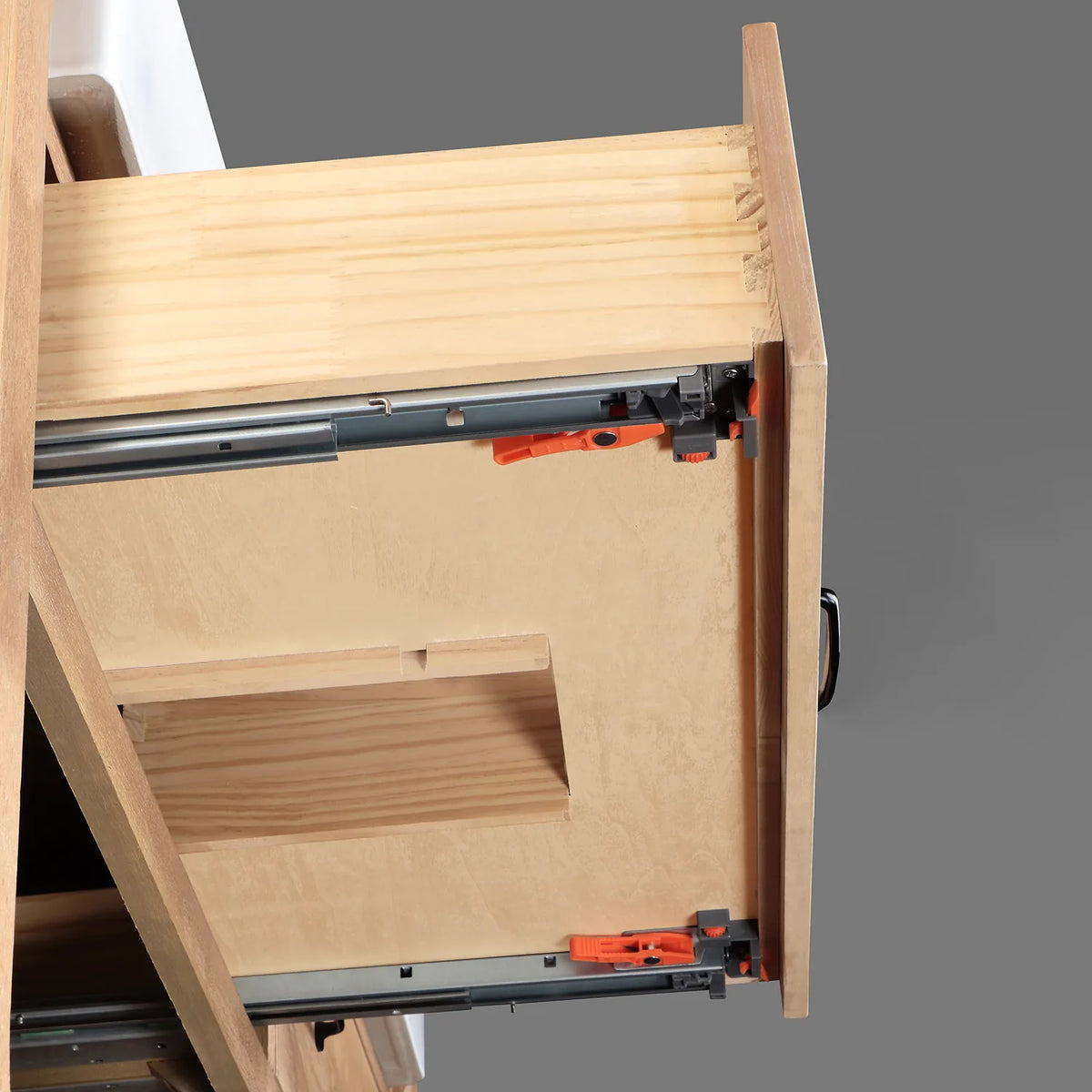 Full-extension drawer glide in close view with dovetailed wood box