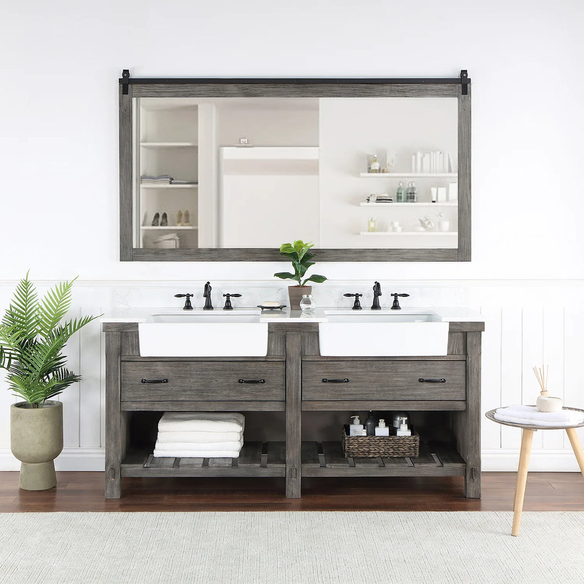Rectangular mirror with sliding-rail hardware hung over the vanity in a styled room