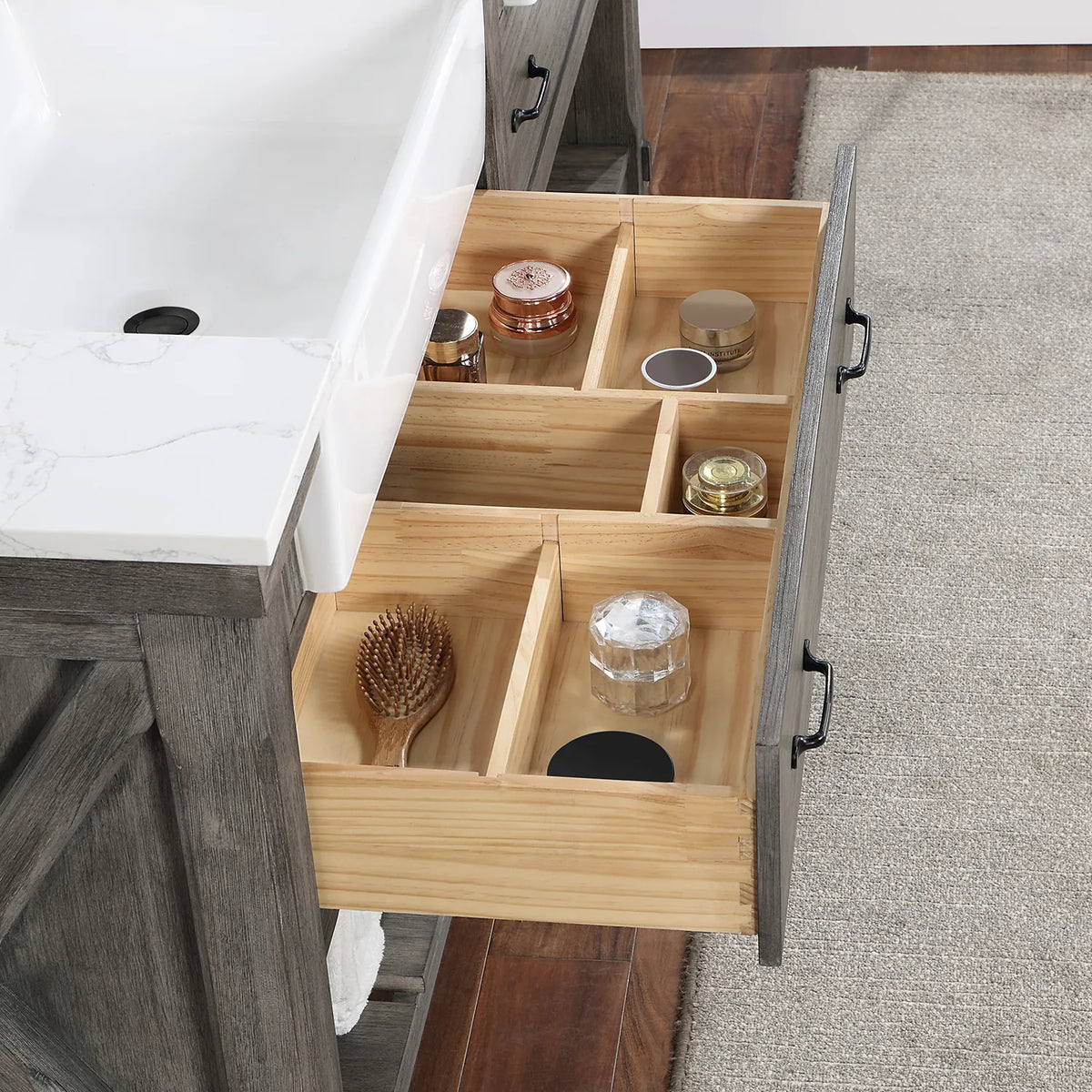 Drawer pulled forward to show its divided wood interior