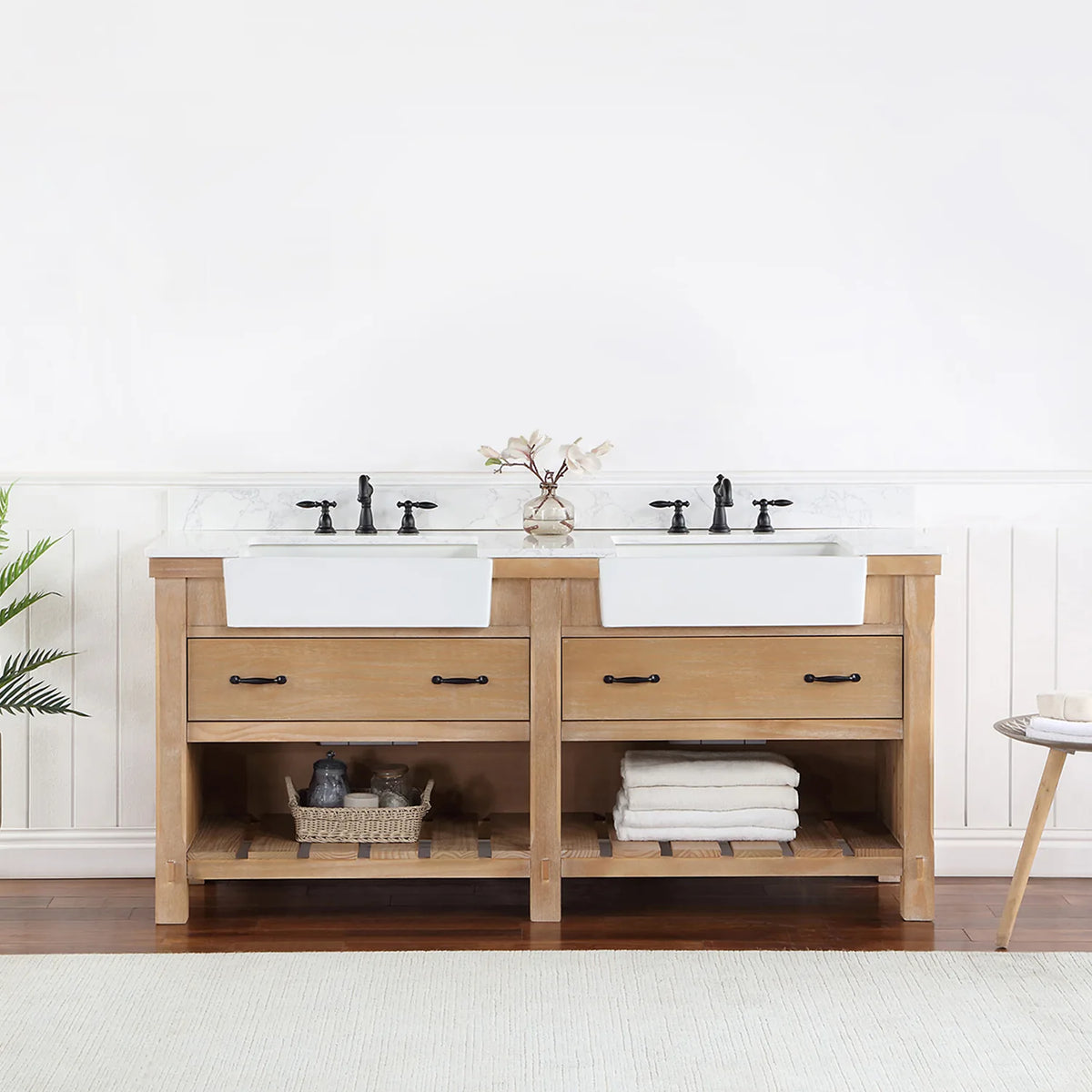 Bathroom setting with white paneled wall, fern and side table beside the vanity