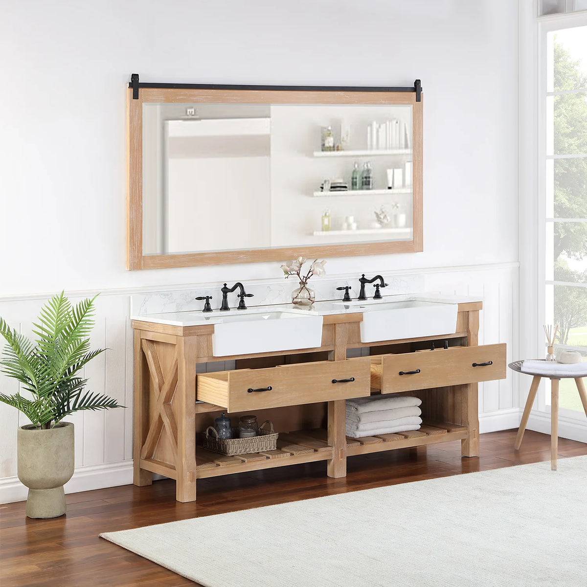 Wide mirror above the Weathered Pine double vanity, both drawers standing open