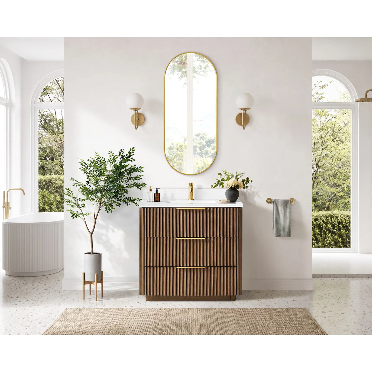 Full bathroom shot: single sink vanity in Oak Light Walnut, arched windows and a freestanding tub