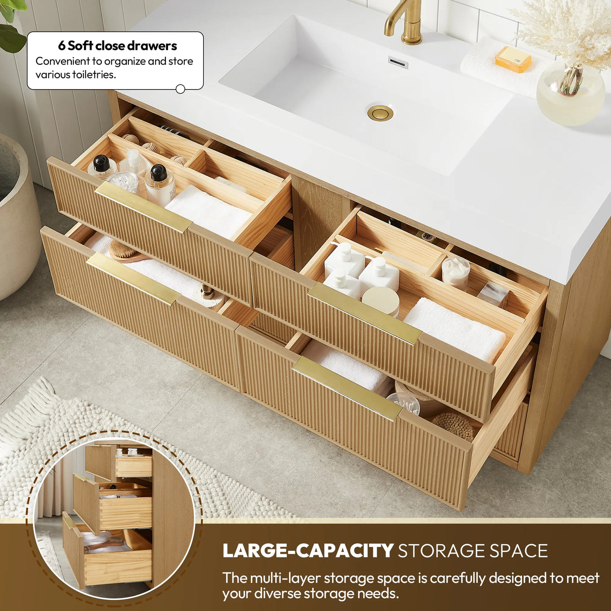 Pair of pulled-out drawers on the 48-inch vanity, organized with wooden trays, plus an inset of stacked drawers
