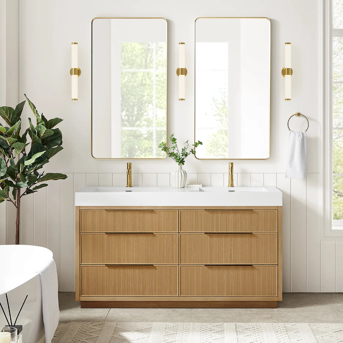 Wide room view of the 60-inch Washed Ash Grey double vanity under two matching mirrors, with a plant and a freestanding tub