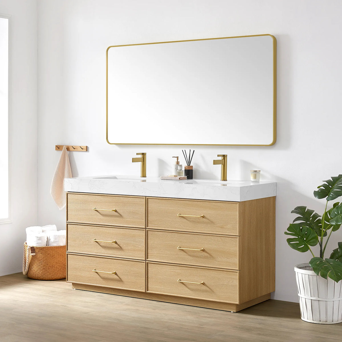 Bathroom setting with the 60 inch vanity, gold-framed mirror and a potted plant by a bright window