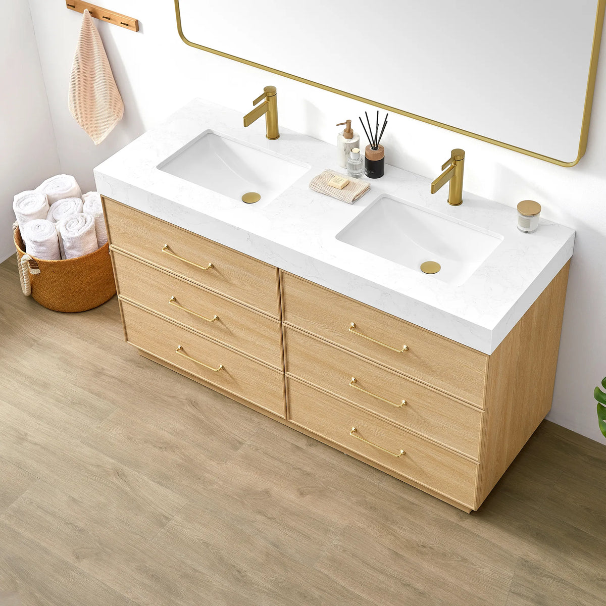 Angled close-up of the Dark Oak vanity with its undermount sink, brushed gold handles and rolled towels