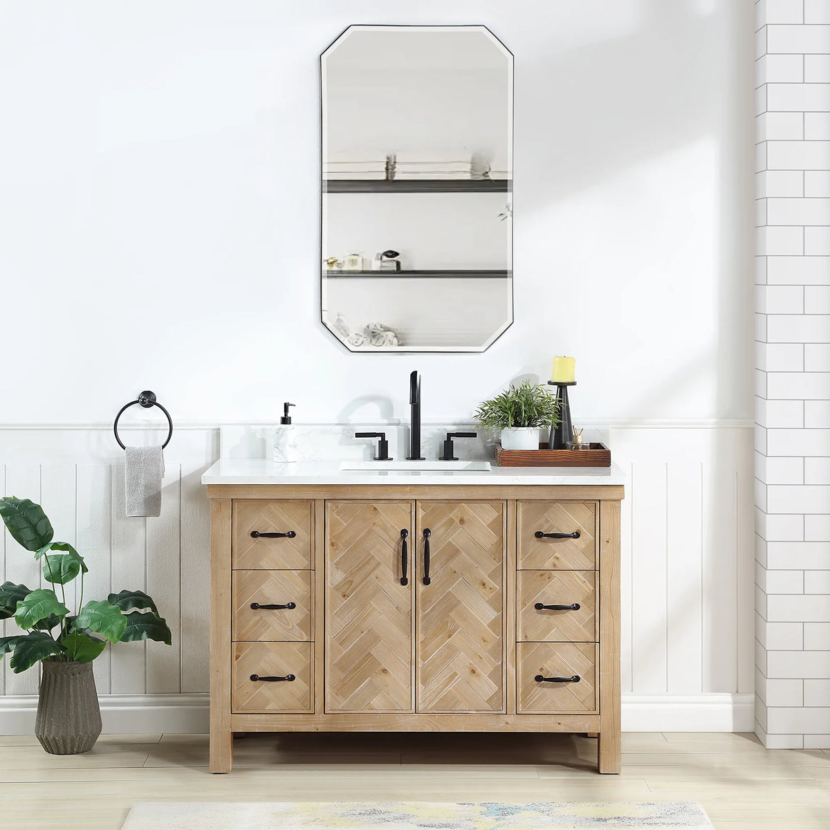 48 inch wood vanity with a white top in a bright bathroom with white tile and an octagon wall mirror
