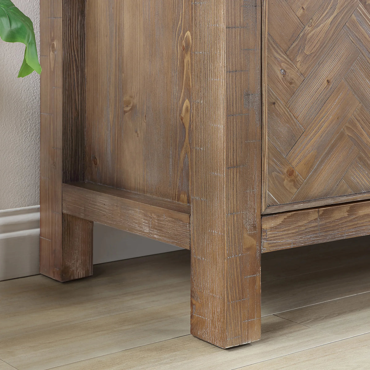 Detail of the solid wood frame and leg at the bottom corner of the 48 inch Spruce Antique Gray vanity