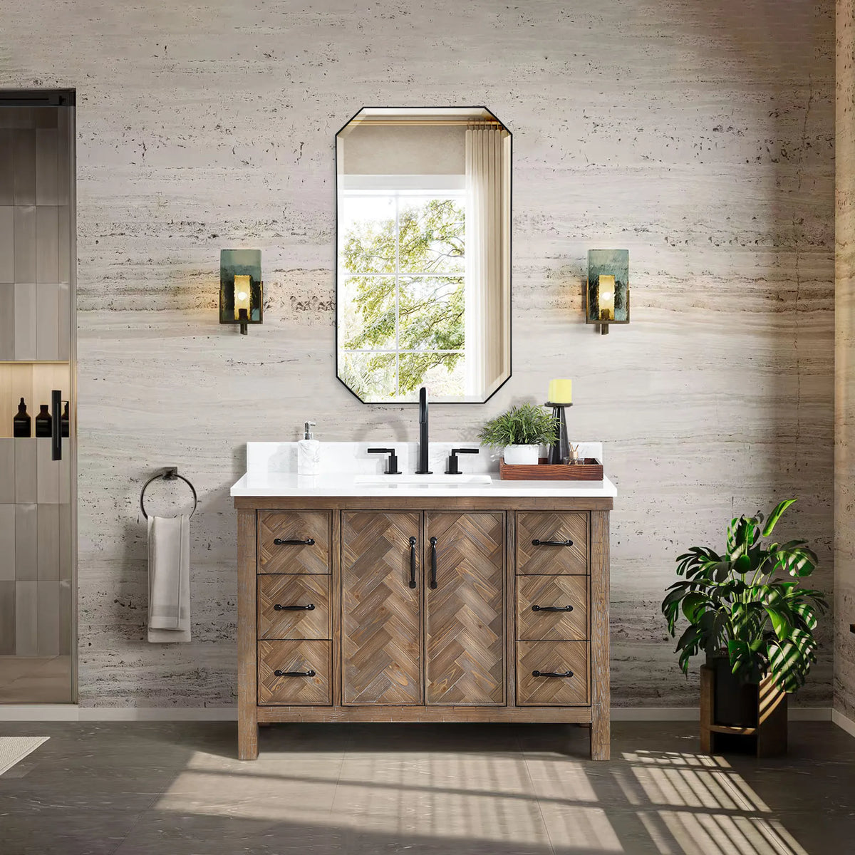 Neutral bathroom with a 48 inch single wood vanity, an octagon mirror, wall lights and a plant