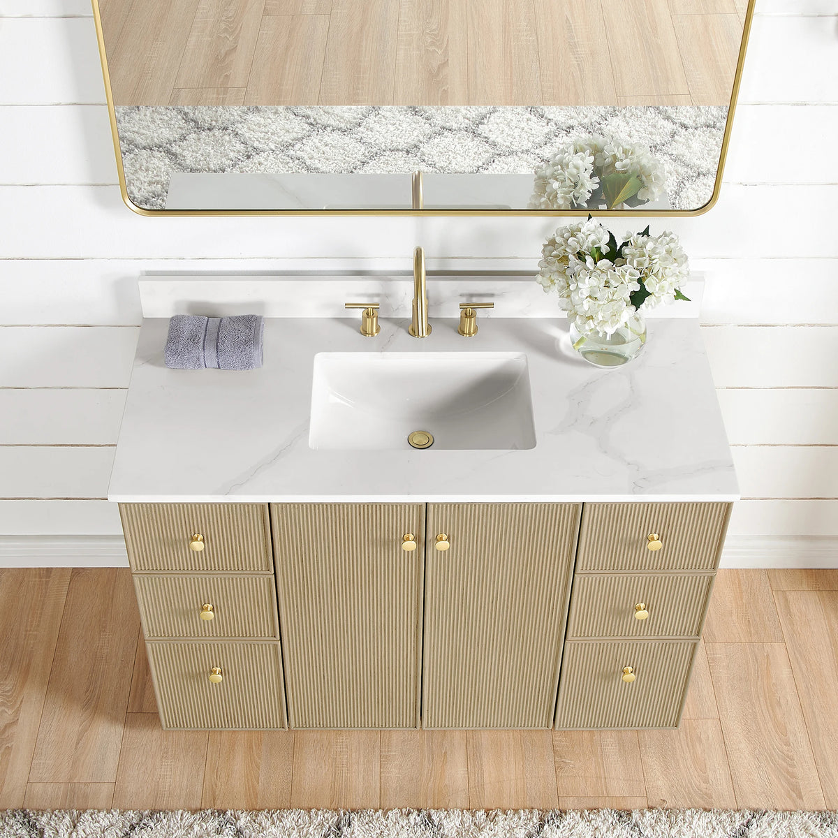 Close view from above of the Calacatta White Quartz top and undermount ceramic sink