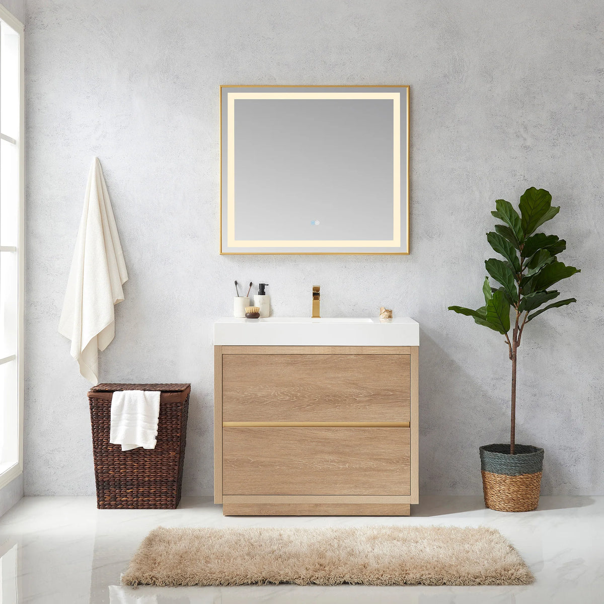 Wide room view of the 36 inch vanity with LED mirror, hamper with a white towel, plant and shag rug