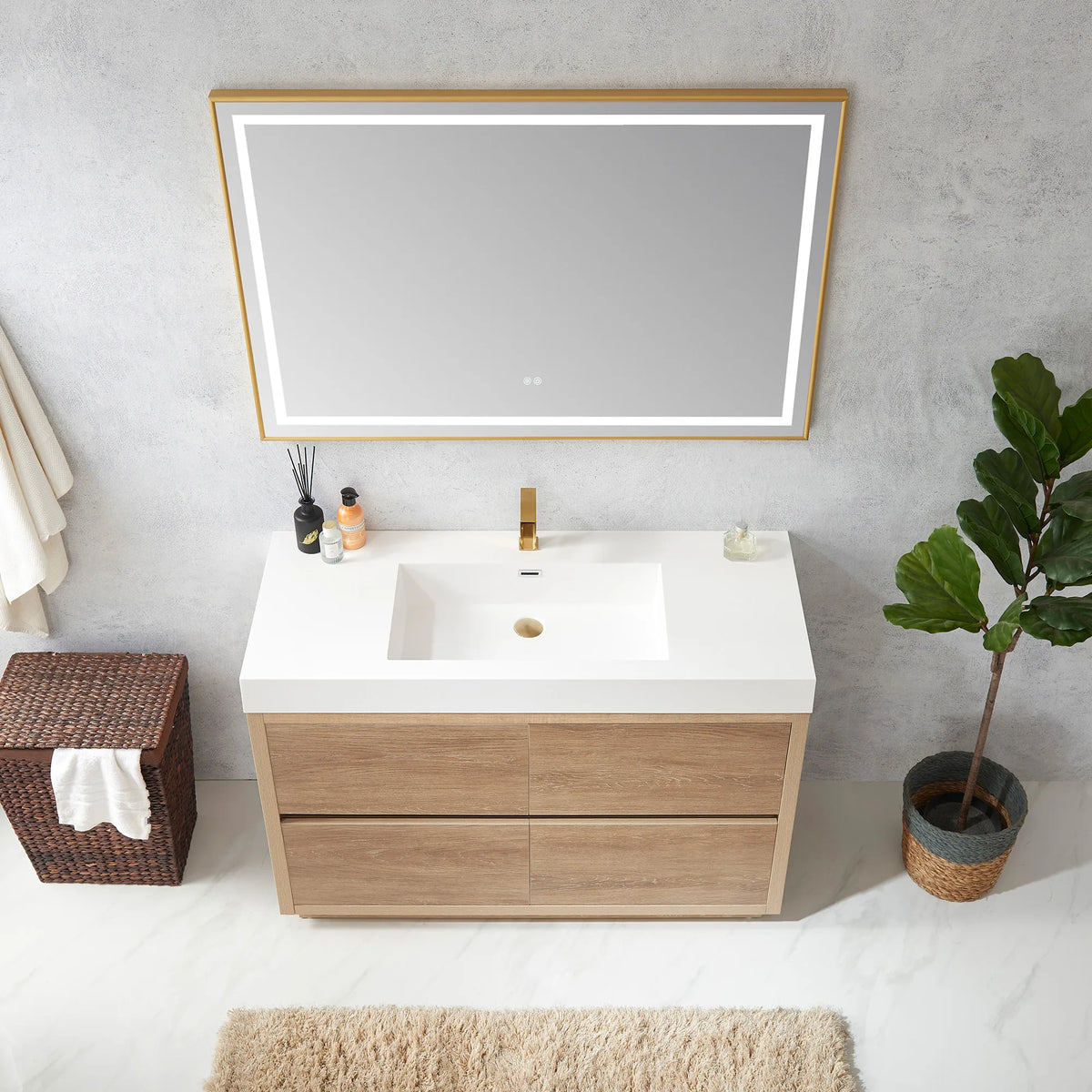 High-angle view of the vanity with LED mirror above, diffuser and bottle on the top