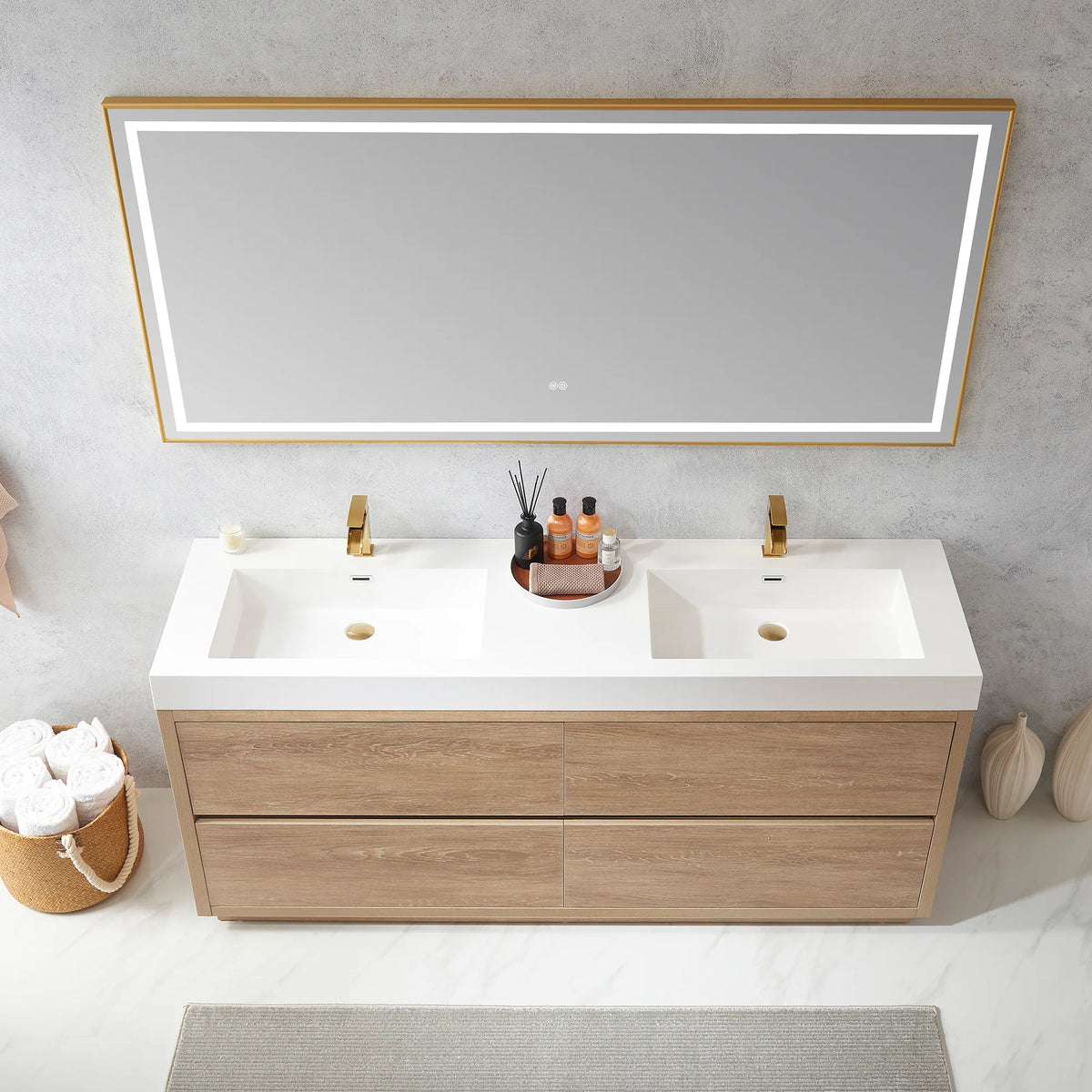 High-angle view of the double sink top with LED mirror above, bottle tray at center, towel basket at left