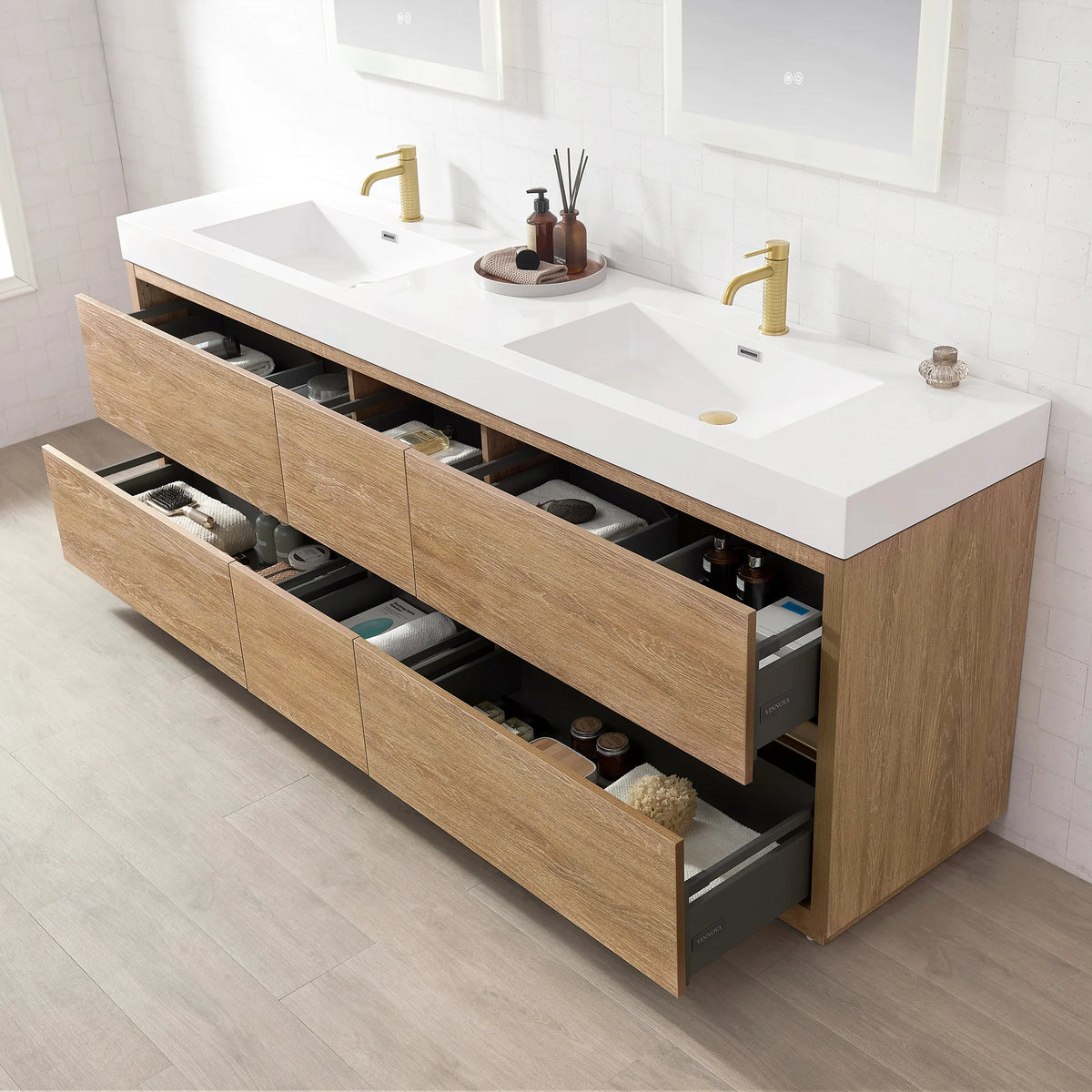 Angled view of the double vanity with drawers open, tiled wall and plank floor