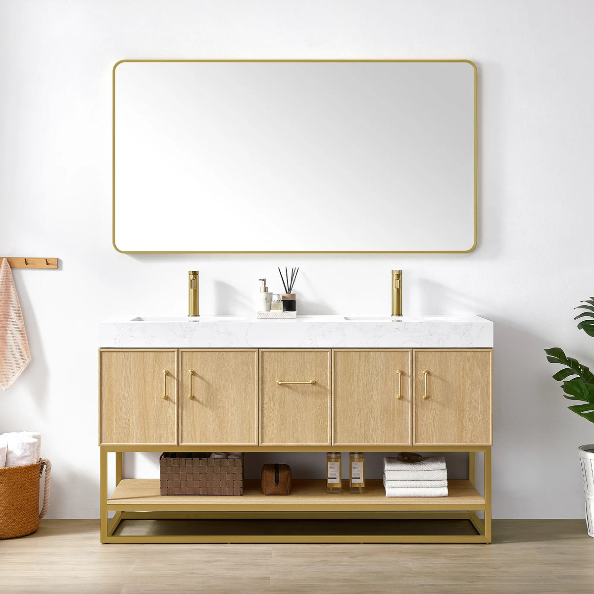 Wide brushed gold wall mirror over the 60 inch Dark Oak double vanity, open shelf with baskets below