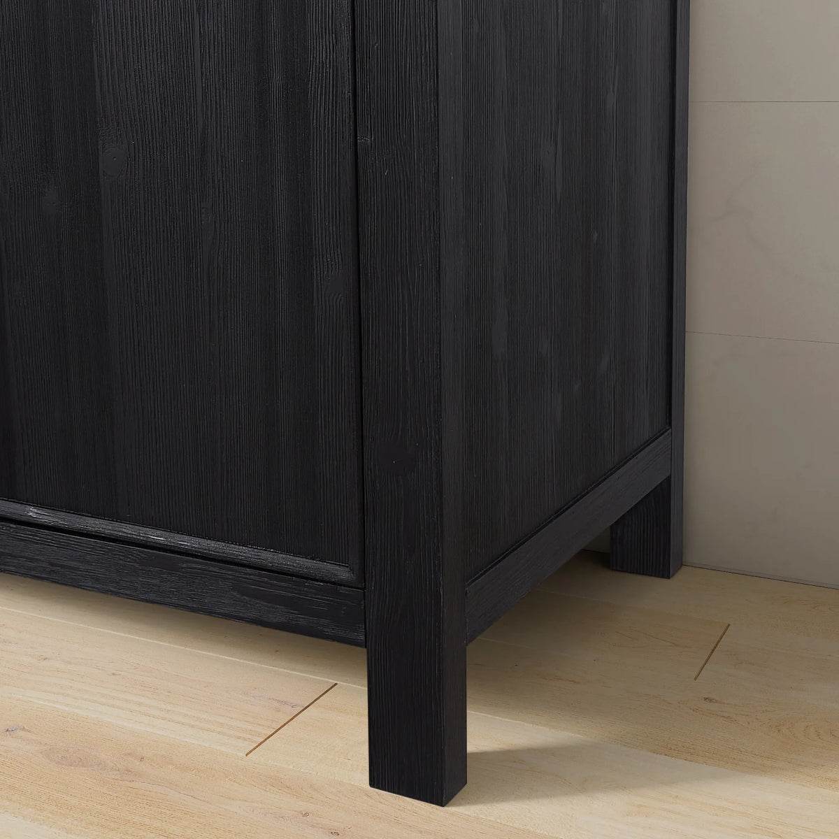Leg and side panel of the 24-inch cabinet at floor level