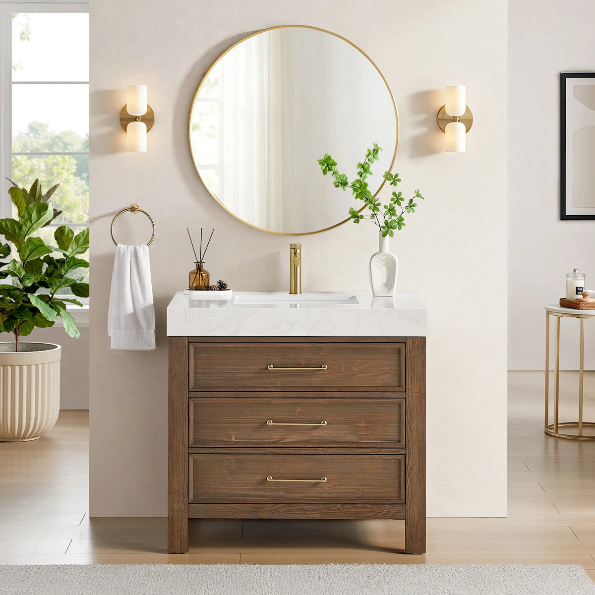 Lifestyle view, Spruce Aged Brown vanity with Lightning White composite stone top; a light bath with gold sconces