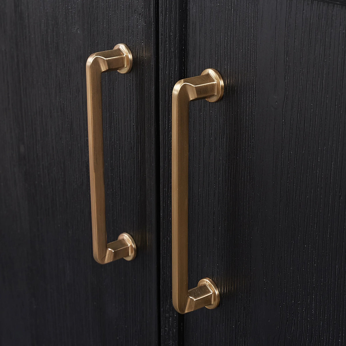 Macro: brushed gold hardware on a Fir Wood Black cabinet door or drawer
