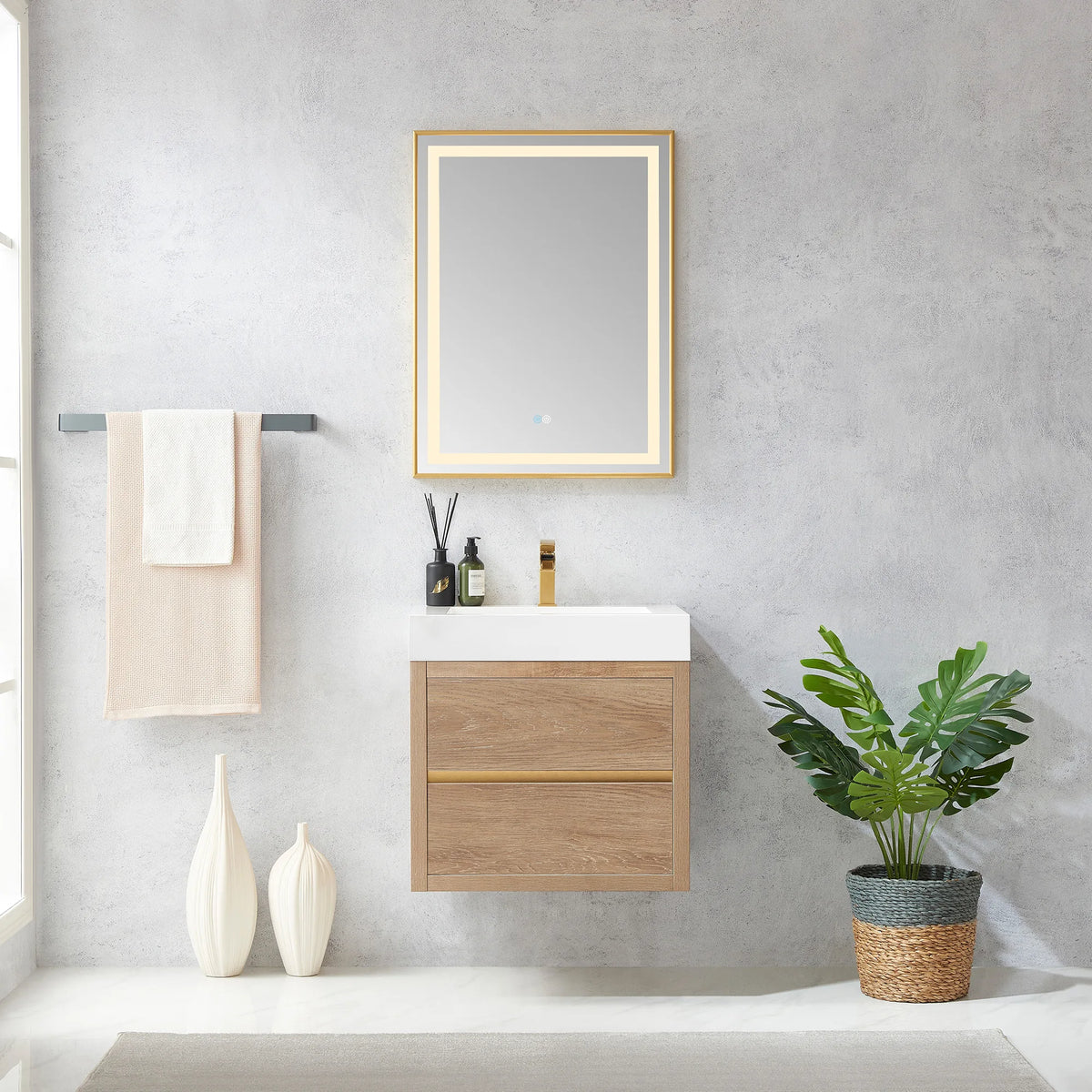24 inch floating vanity in North American Oak with a rectangular LED mirror, towel bar and potted plant in a light bathroom